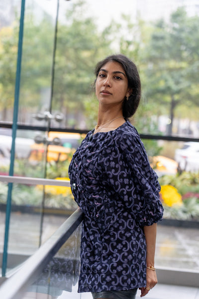 Blue smocked evening coat with beading