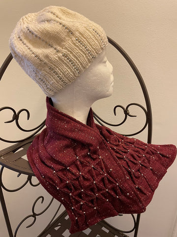 Smocked cowl in cranberry plaid wool with seed beads