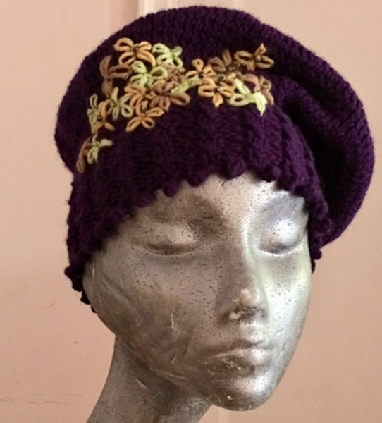 Knitted cowl in multi-colored yellow and purple wool